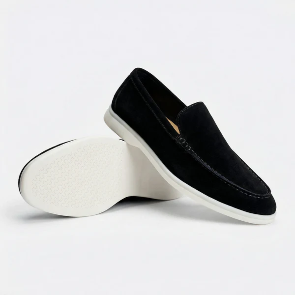 Men's suede slip-on loafers with a lightweight sole shown in a neutral color