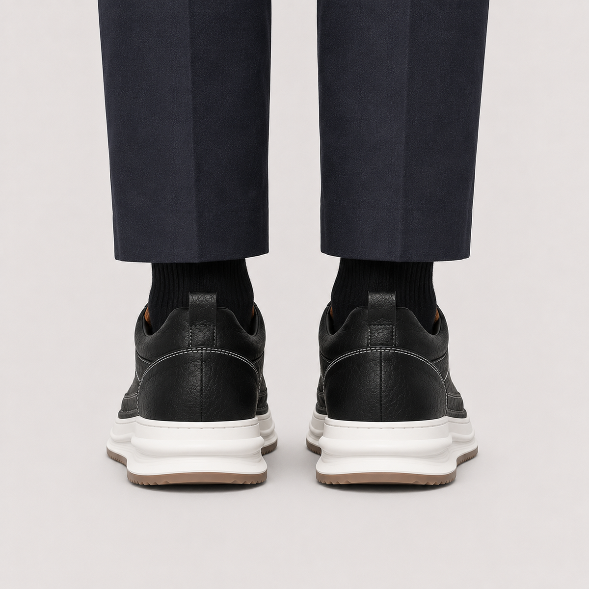 Men's leather look low-profile sneakers in black and brown