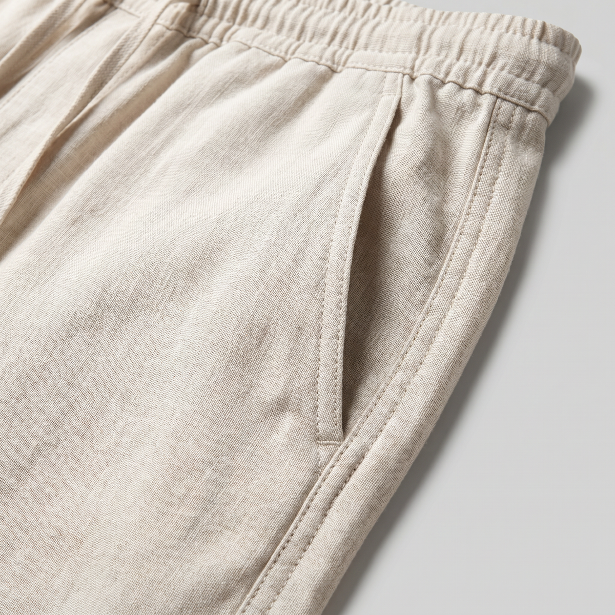 Men's beige baggy linen trousers with loose fit and drawstring waist