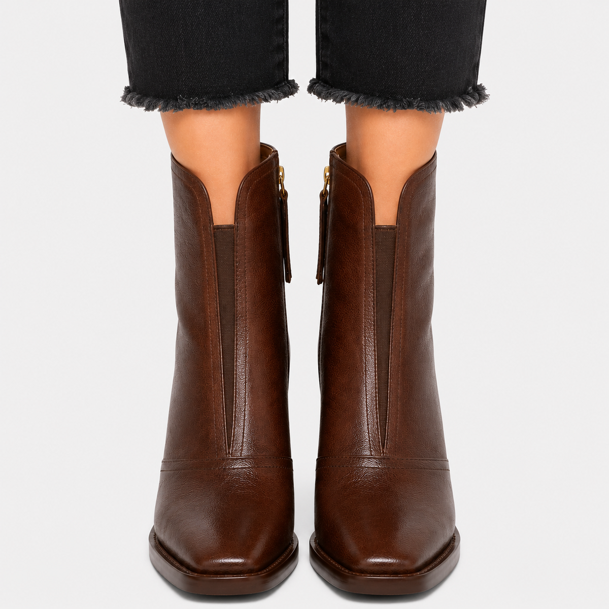Women's leather-look slip-on ankle boots in black and brown