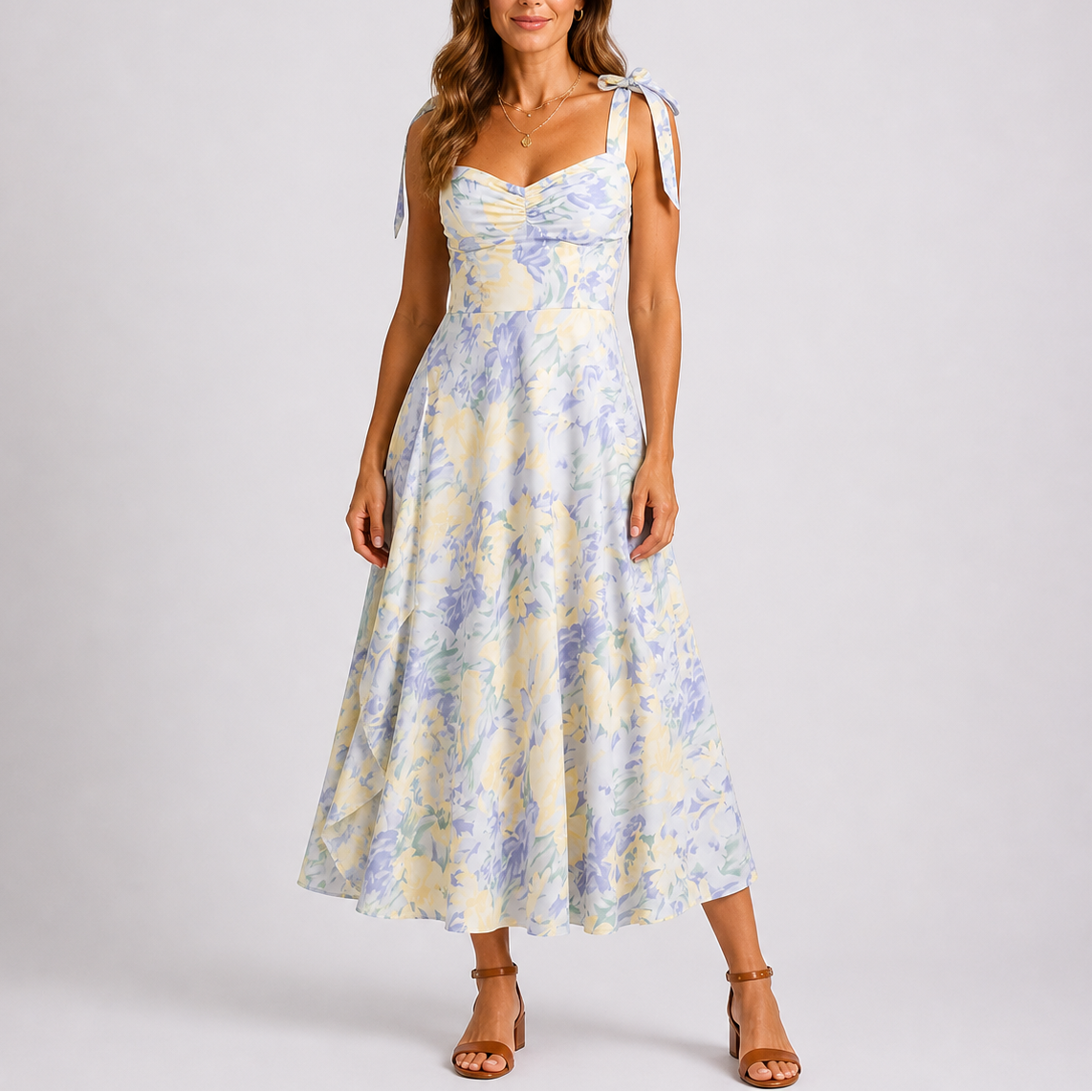 Floral print midi dress with ruched bodice and adjustable tie-shoulder straps