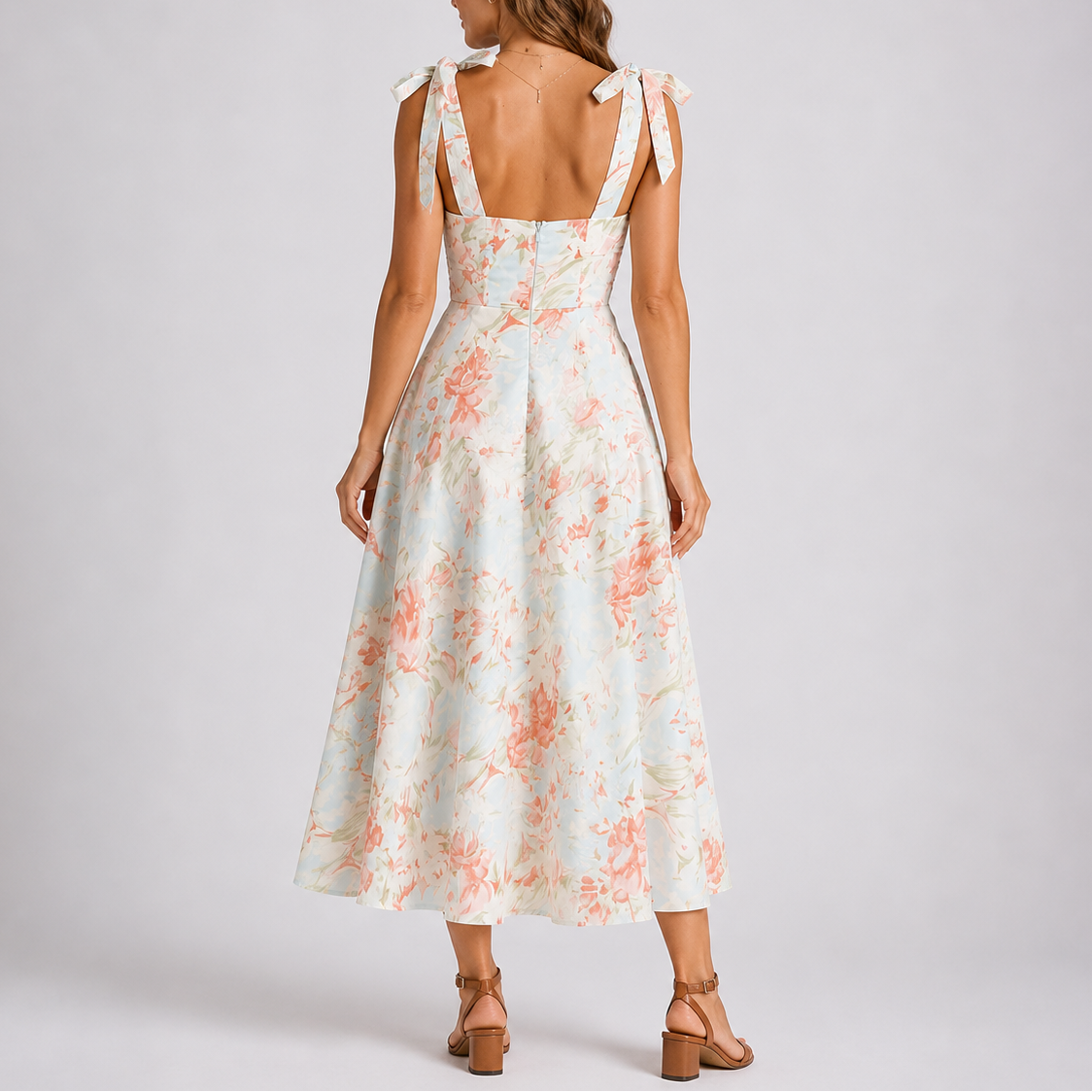 Floral print midi dress with ruched bodice and adjustable tie-shoulder straps