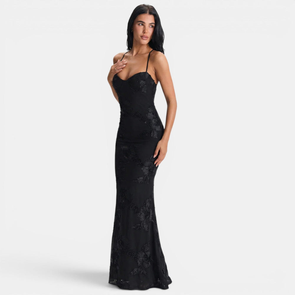 Black lace maxi evening dress with open-back design and flowing floor-length skirt