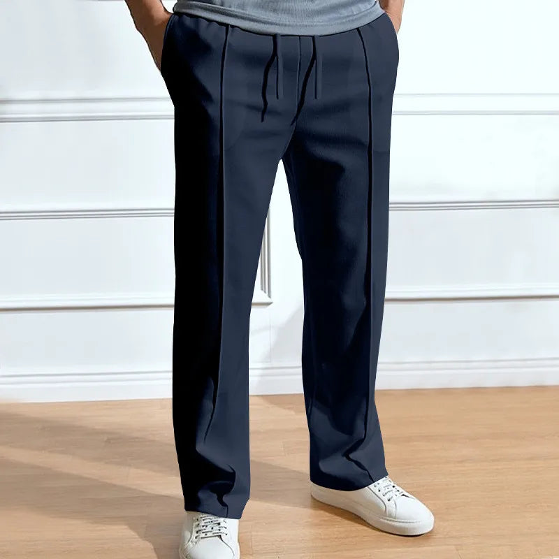 Men's slim fit elastic waist drawstring trousers shown in multiple colors