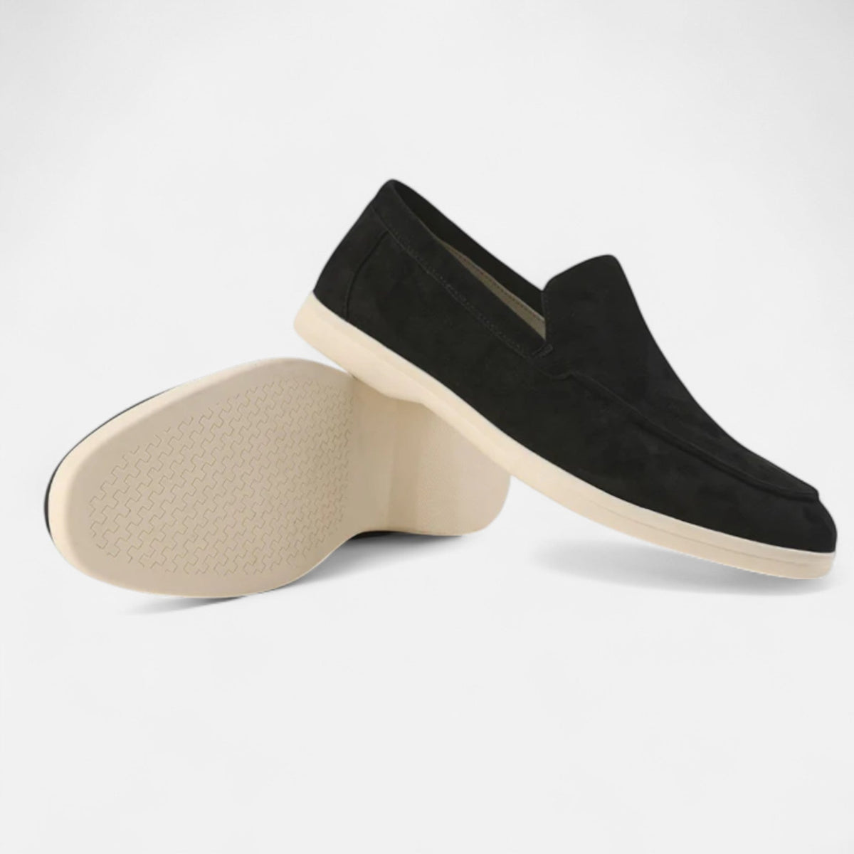 Men's suede penny loafers with classic silhouette and hand-stitched detailing