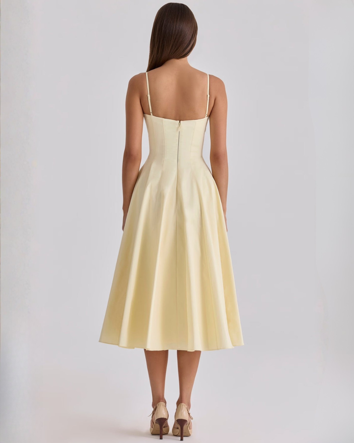 Yellow cotton midi dress with adjustable spaghetti straps and side pockets