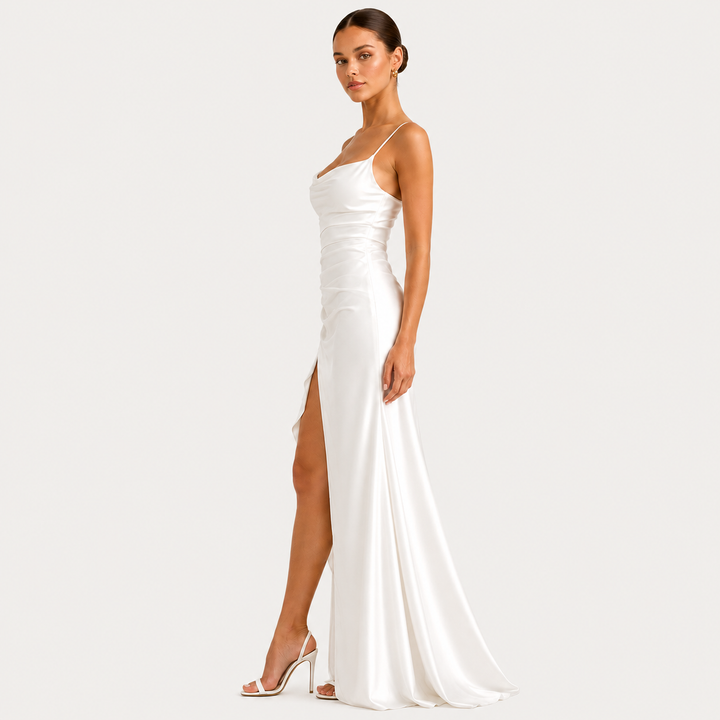 Draped sleeveless satin maxi dress with side slit in an elegant flowing silhouette