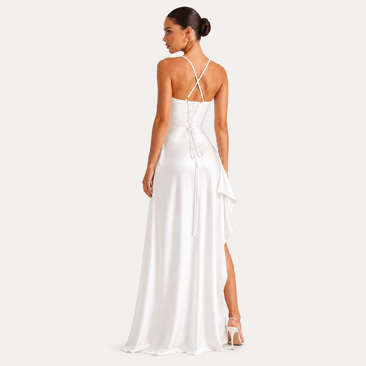 Draped sleeveless satin maxi dress with side slit in an elegant flowing silhouette
