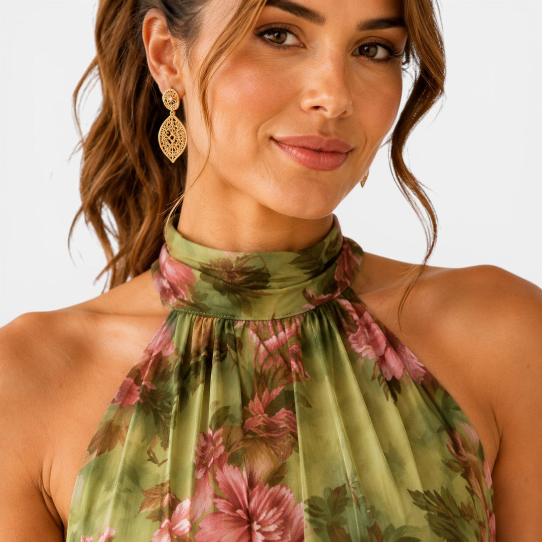 Green floral halter neck maxi dress with flowing skirt