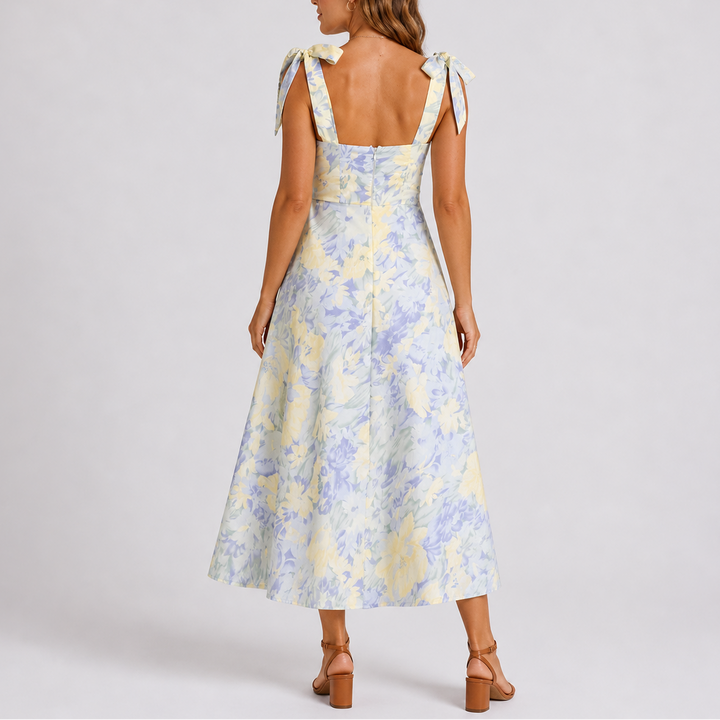 Floral print midi dress with ruched bodice and adjustable tie-shoulder straps