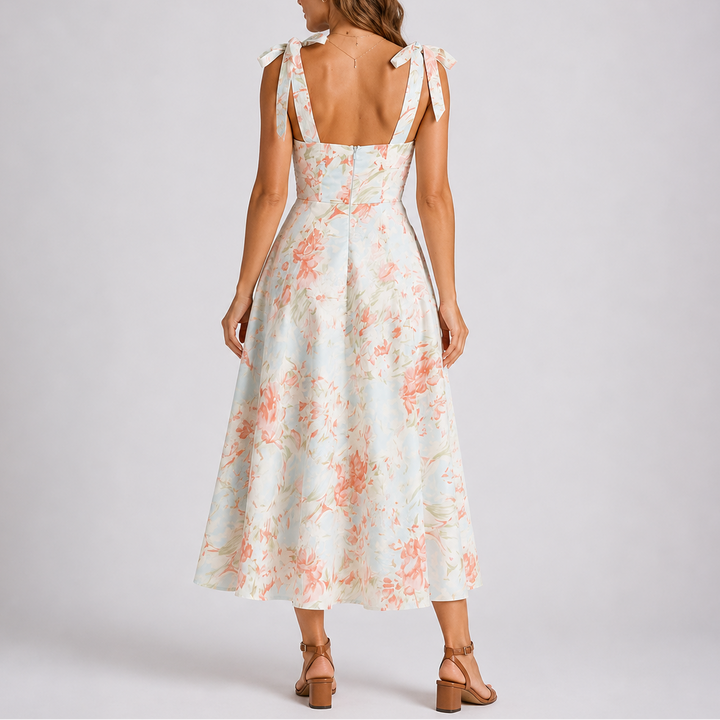 Floral print midi dress with ruched bodice and adjustable tie-shoulder straps